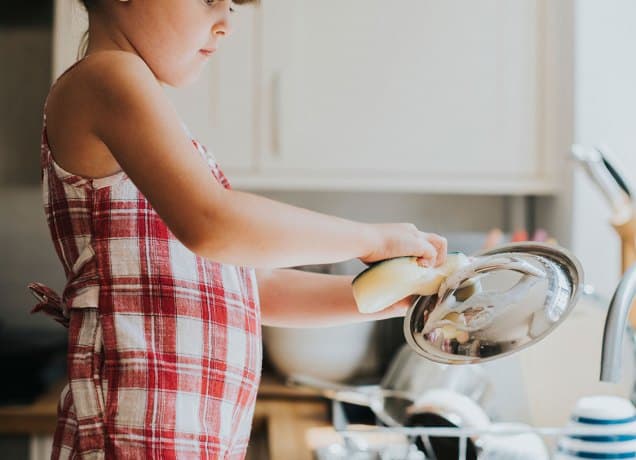 i-hold-my-son-and-daughter-to-different-standards: a young girl washing dishes