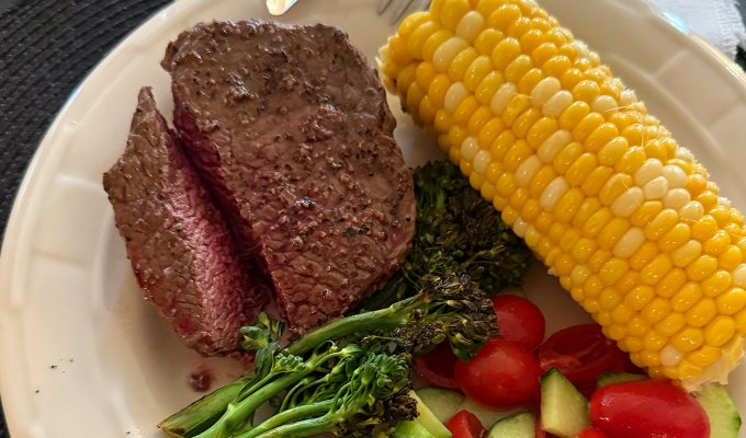 best steak delivery service: snake river farms steak with corn and vegetables