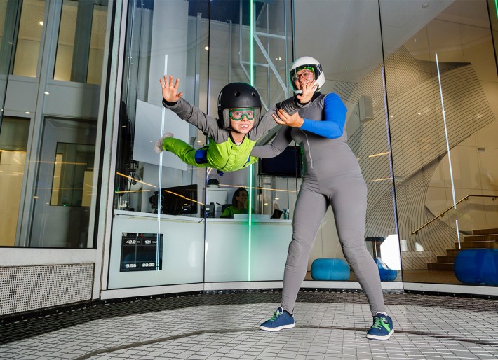 experience-gifts-for-kids: a child trying indoor skydiving
