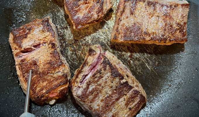 steak delivery service: omaha steaks steak cooking in a pan